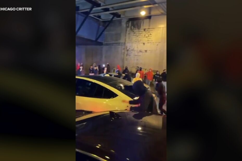A downtown driver crashed into another vehicle while trying to escape from a group of people damaging his car.