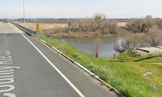 A man who had apparently witnessed the crash went into the river and brought the child to shore.